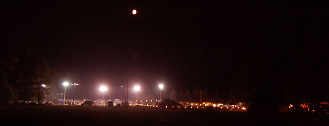 A red moon sails the inky skies above Centennial Park Friday. David F. Rooney photo