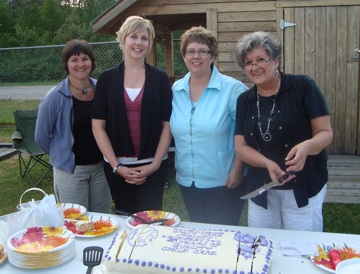 Child Care Society Chairwoman Carolyn Duncan joined Jenny Dierick, Manager of Care for Stepping Stones Child Care Centers, Linda Chell Child Care Resource and Referral Coordinator and Executive Director and Linda Richardson, a 20-year employee of the Child Care Society to cut the cake at the Celebrating 20 Years of Quality Child Care Choices family barbeque a couple of weeks ago.  Over 100 children, parents and child care providers enjoyed the activities, BBQ, child care provider appreciation and the interactive story The Wide Mouth Frog by Tracy Spannier, Family Literacy Coordinator. Photo courtesy of the Revelstoke Child Care Society