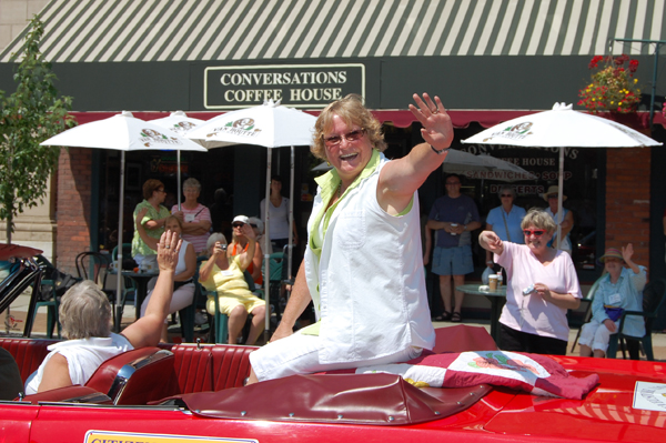 Citizen of the Year Ginger Shoji waves to the crowd during the parade. David F. Rooney photo