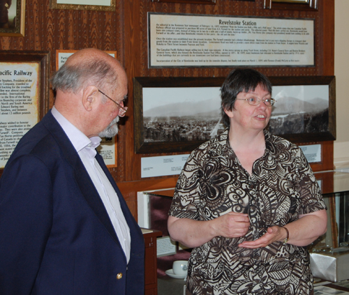 James Baring, Lord Revelstoke, listens as Revelstoke Museum Curator Cathy English speaks at the opening of a new exhibit that tells the story of Revelstoke's change of name. David F. Rooney photo