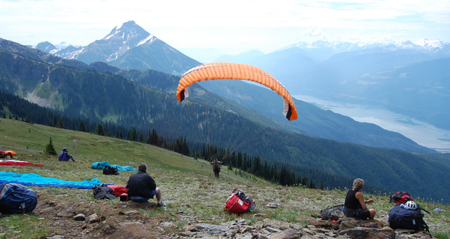 All it took was a momentary change and a paraglider took to the air Sunday morning after waiting for what seemed like an hour for the right conditions. This young woman's launch sparked more launches. David F. Rooney photo