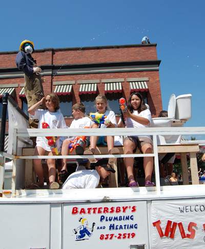 These kids on the Battersby Plumbing float got a kick out of soaking the crowd. David F. Rooney photo