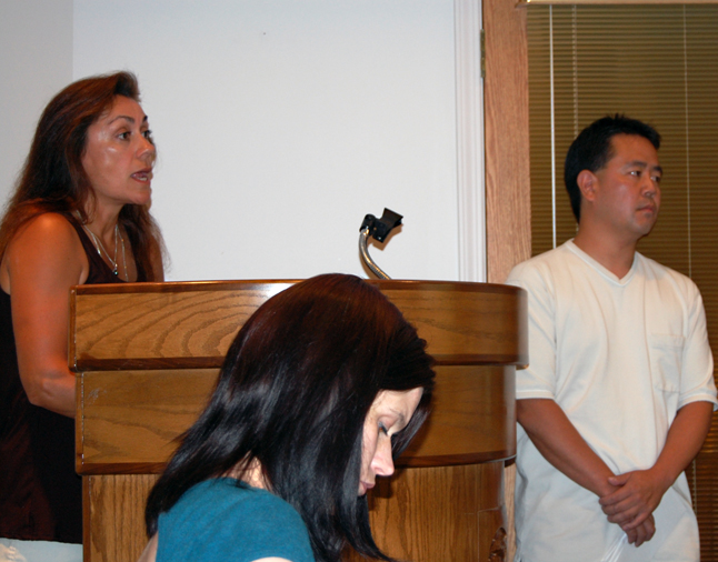 Grizzly Book Shop owner Vanessa Smith (left) speaks to Council as Intense Audio and Video owner Jason Shoji (right) listens. David F. Rooney photo