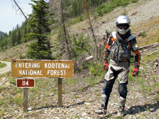 Rich Hamilton poses by the sign announcing Kootenai National Forest in the U.S. He and Gary deBlock are heading to Mdexico along the spine of the continent. Photo courtesy of Robin Suopanki 