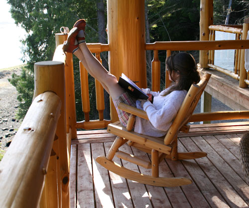 Gwen Lips stretches her legs as she sketches on the lodge deck. Photo courtesy of Cherie Vanoverbeke