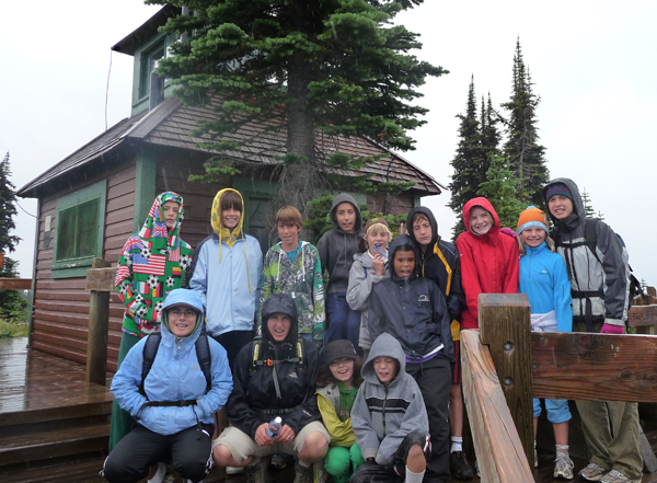 Adrenaline Week at the Community Connections' Pre-Teen Summer Camp brought kids and counsellors to the top of Mount Revelstoke where, among other things, they posed in the rain. Photo courtesy of Anne Corrie 