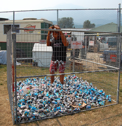 The traditional Sasquatch keeps tabs on a growing mound of empties at Centennial Park. David F. Rooney photo