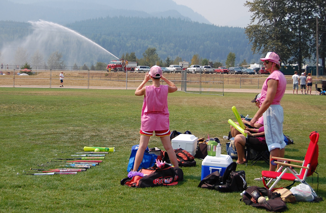 One of the Gay Unicorns looks longingly at the fire truck spraying down ballplayers at a distant field. David F. Rooney photo