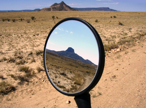 Desert and buttes ahead; desert and buttes behind. Photo courtesy of Rich Hamiton