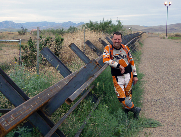 Gary DeBlock rests against a steel fence line. Photo courtesy of Rich Hamiton 