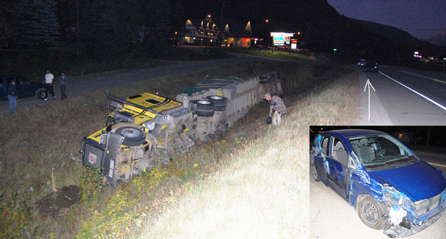 A man scrambles into the ditch along the Trans-Canada Highway at West Revelstoke to more closely examine a transport truck that overturned after sideswiping West-bound car that was preparing turn left to the Great White North Restaurant early Saturday evening. David F. Rooney photo illustration