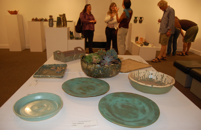 Plates, platters and planters by Toni Johnston, Erin Potter and Linda Hay and Heather Duchman almost seemed made of copper — not clay. David F. Rooney photo