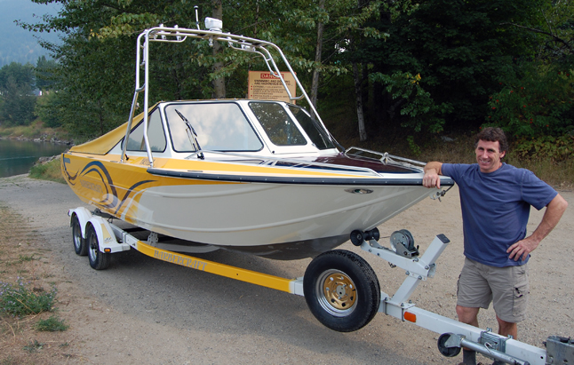 David Adshead poses with the jet boat that has some people wondering about the environmental integrity of the Columbia River and the adjacent wetlands. David F. Rooney photo