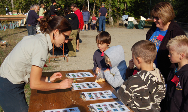 Parks Canada's Alice Weber tells kids the rules of the Kokanee Fish Festival Scavenger Hunt down at Bridge Creek on Friday. David F. Rooney photo