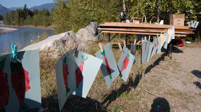 Paintings by the kids who attend the annual Kokanee Fish Festival dry in the sun. David F. Rooney photo