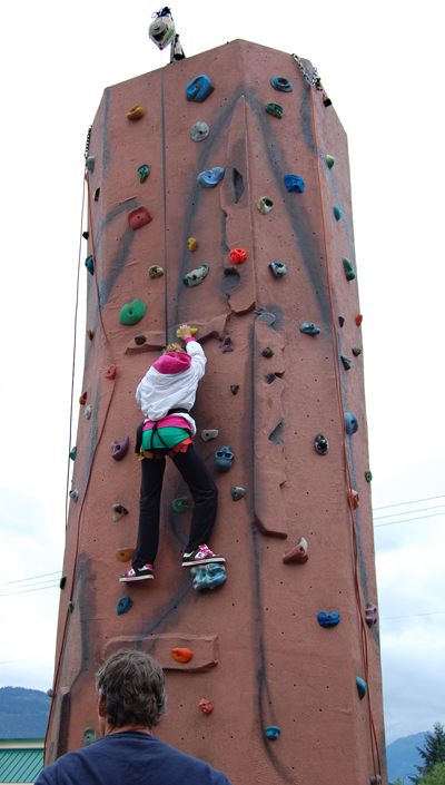 Kelsey March ascends the climbing wall set up by the Credit Union. David F. Rooney photo