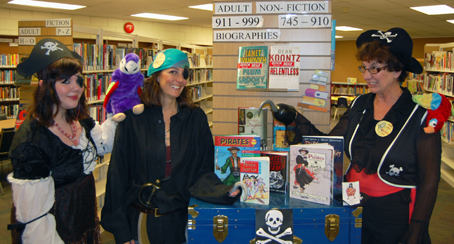 Argh! Even pirates like to read, matey! That's the message these bucaneering librarians at the Revelstoke Public Library wanted to pass along to patrons during the increasingly popular — and decidedly oddball — Talk Like A Pirate Day on Sept. 19. From left to right are the swashbuckling Meagan (The Parrot Pirate) Walford, Susan (The Hook) Knight and Joan (Captain Long Joan Silver) Holzer. Argh! You can see them pass their message along to YouTube viewers by going to The Current Video Playlist on the front page. David F. Rooney photo