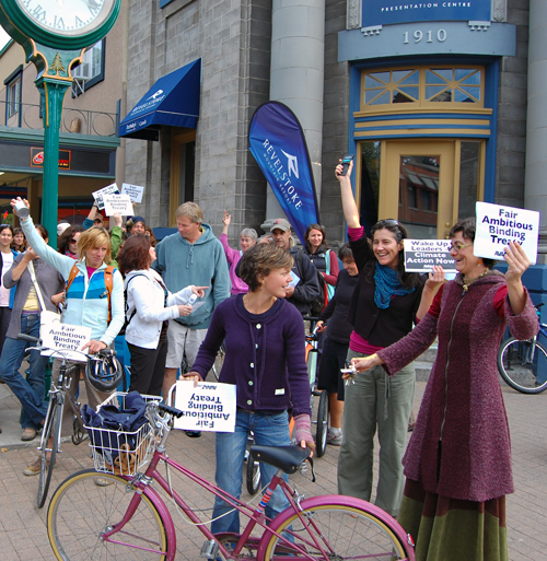 Concerned citizens gathered in what is known as "a flash mob" at Grizzly Plaza Monday to call on Canadian leaders to take action on climate change. At exactly 12:18 pm they rang alarm clocks and used cellphone to call the office of Prime Minister Stephen Harper and other leaders to demand that Canada take serious action on climate change. They were just one of more than 2,000 similar protests that occurred at exactly the same time in more than 100 countries. David F. Rooney photo