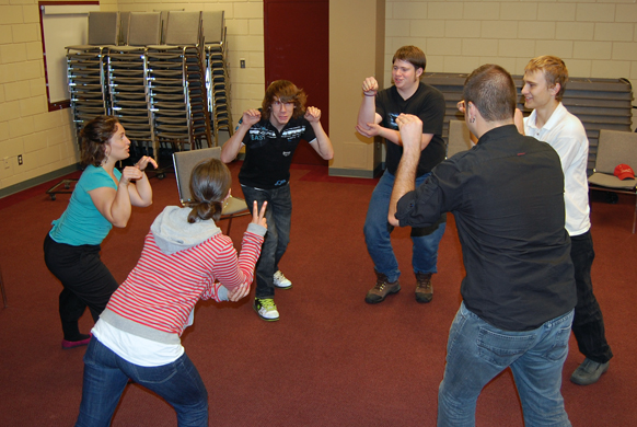 Members of the brand new Theatre Sports Club run through an exercise at the Community centre under the supervision of drama teacher Anita Hallewas Monday evening. David F. Rooney photo