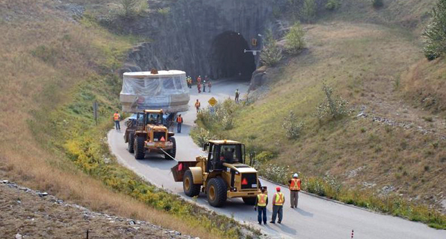 Finally unloaded from the transporter, the turbine is carefully carried through the 100-metre-long tunnel that leads to the Revelstoke Dam. Dusty Veideman photo courtesy of BC Hydro 