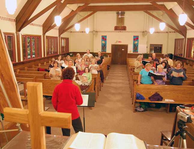 Robyn Abear (left in the red fleece) runs members of the Community Choir through their paces during a rehearsal Tuesday evening of their portion of the programme for the Voices for Hospice Concert that will be held at the United Church on Oct. 17 at 7 pm. Accompanied by pianist Lida Carey, the choir sang beautifully. How beautifully, you may ask? You can judge for yourself by going to The Current Video on the front of The Revelstoke Current news site. Be sure to pencil in that concert on your calendar and come out to show your support for our community's Hospice Society. David F. Rooney photo