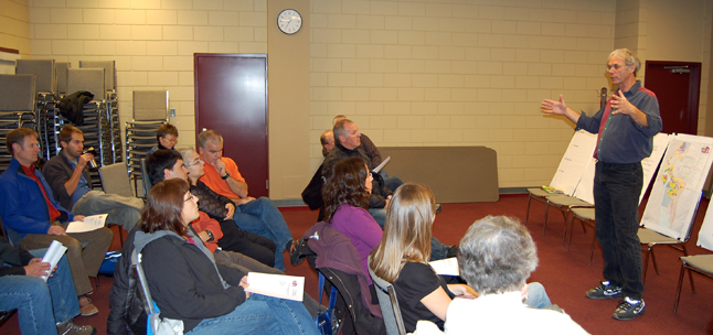 City Planner John Gunther (right) talks to a group of 13 central residential area residents Wednesday about the need to form neighbourhood community groups that can help guide the development process. David F. Rooney photo