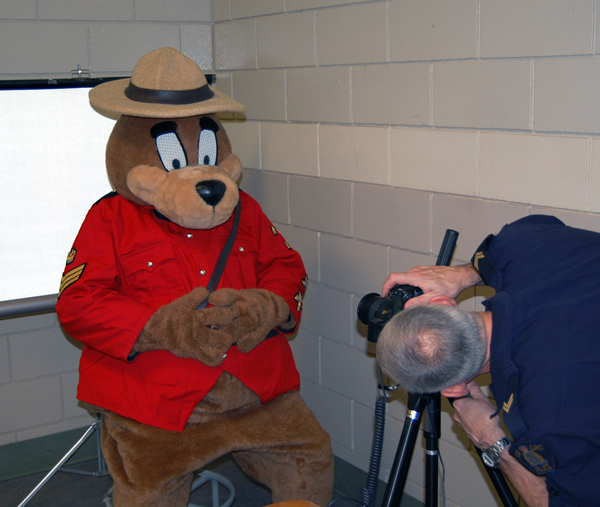 While Cpl. Morris was mainly focused on taking the kids' photos, Safety bear prevailed upon him for his own portrait. David F. Rooney photo