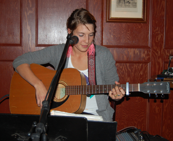 Suzanne Ziegler of Switzerland was one guest at the Last Drop who took to the Open Mic, playing guitar and singing. David F. Rooney photo