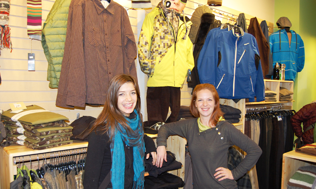 Wearbouts manager Monica Hardy (right) poses with sales staffer Cara Funke in front of some of the clothing on offer at the small, local chain's new store at the corner of Second Street and Mackenzie Avenue. David F. Rooney photo