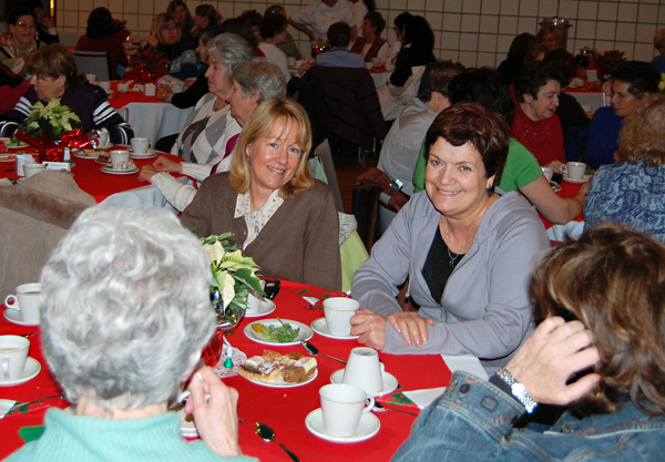 Brenda Kessler (center) and Maria Stagliano enjoy tea and sandwiches with friends. David F. Rooney photo