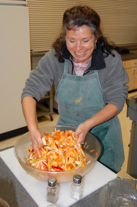 Elena Bishop mixes a refreshing and zesty jicama and pepper salad. David F. Rooney photo