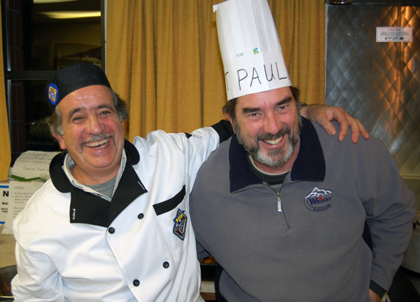 Paul Suraci (left) and Keith Burgart horse around in the kitchen of the St. Francis of Assissi Parish Hall Sunday afternoon while taking a break from helping whip up a meal for the CFL fans who turned out for the Knights of Columbus' traditional Grey Cup Party and enjoy a fantastic meal. David F. Rooney photo