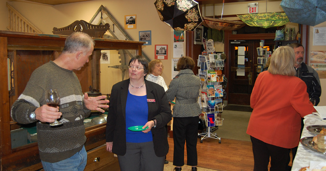 Heritage Committee Chairman Mike Dragani (left) talks with Museum Curator Cathy English at the 50th Anniversary Celebration held at the Revelstoke Museum & Archives on Friday evening. David F. Rooney photo 