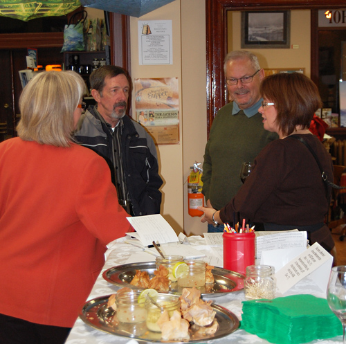 Sharon Kelley (left) and her husband Jim Cook (center) talk with friends at the Museum's 50th Anniversary Celebration. David F. Rooney photo