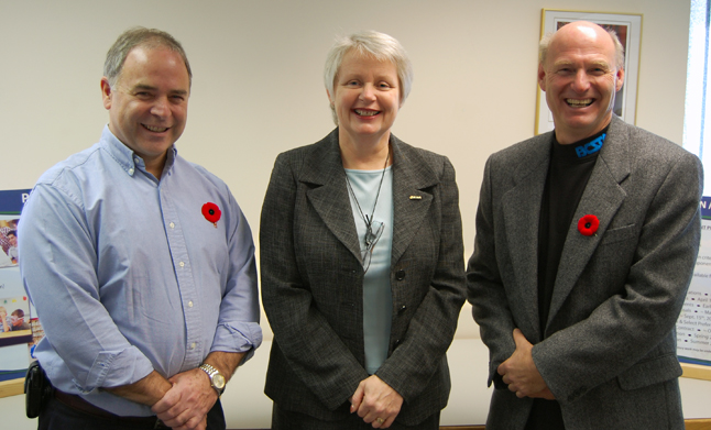 Superintendent Anne Coope (center) poses with Mayor David Raven (left) and School Board Chairman Alan Chell after Wdnesday's announcement that Revelstoke will pioneer the province's Neighbourhoods of Learning program. David F. Rooney photo