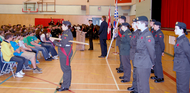 Framed by a Colour Guard of Army Cadets, Able Seaman Chris McKnight, talks about the importance of the sacrifice veterans have made for all Canadians. David F. Rooney photo