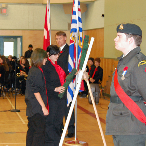 Students lay a wreath on the cross used during the RSS Remembrance Day ceremony on Tuesday. David F. Rooney photo