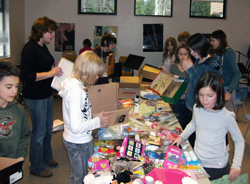 Last Friday (Nov. 20) AHE Student Council members spent  their lunch time sorting through the variety of items brought in by their fellow classmates as part of the Operation Christmas Child campaign. Items are placed in shoeboxes and sent to children in need around the world by the Samaritan's Purse organization. Photo courtesy of Arrow Heights Elementary School