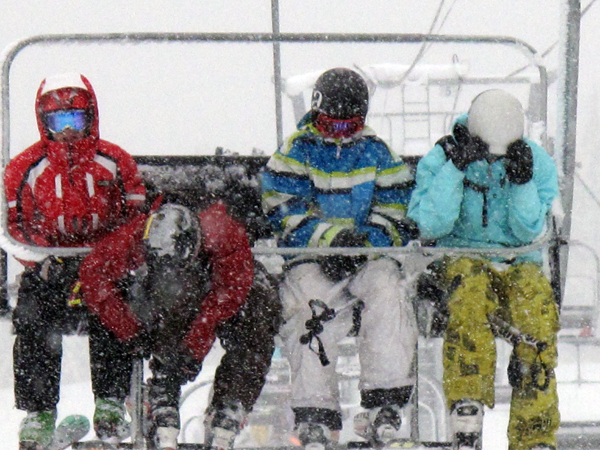 Of course, getting to the top meant getting a few flakes in your face, especially if, like these four boy, you were the very first people in line — at 5:30 am. Photo courtesy of Karilyn Kempton/Revelstoke Mountain Resort