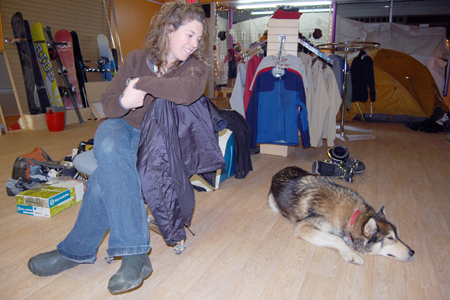 Anne-Marie Lefaivre smiles warmy at her dog Chimo as he snoozes away during an interview about her new business, Back On The Rack. She and her partner, Anne Morrison, are opening their shop for business on Saturday, Dec. 19. David F. Rooney photo 