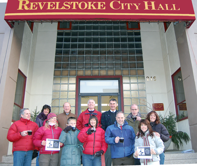 Revelstoke is Canada's latest community to win official Fair Trade Town status. Members of the Revelstoke Fair Trade Committee got together on the steps of City Hall with Mayor David Raven and City Councillors for a cup of Fair Trade java and an official photo op. From left to right, starting in the front, are: Corin Flood, Josee Zimanyi, Councillor Antoinette Halberstadt, Mary Clayton, Mayor David Raven and Lisa Canicilla-Sykes, Behind them, form left to right, are: Shirley Berg, Revelstoke's Chief Administrative Officer Ross McPhee and Councillors Phil Welock, Peter Frew and Chris Johnston. After a quick 10 or so frames, the group returned to Council Chambers where Knight read a letter, which is reproduced below, on behalf of the committee. David F. Rooney photo