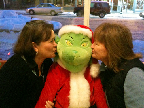 Oh! The Grinch gets a couple of smackers from Heather Duchman and Chris McMillan. Photo courtesy of Laurel Russell 