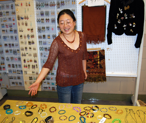 Yan Liu shows off some of her hand-made jewellery at the No Host Bazaar on Sunday. The 34-year-old from northern China is ambitious and hopes to build a better life here in Revelstoke. David F. Rooney photo