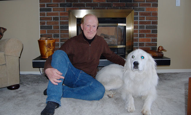 Ross McPhee at home with Patches after his pet's miraculous return home after being lost in the mountains for 11 days. David F. Rooney photo