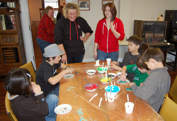 Jenna Smit (left) and Sarah English were two of the volunteers who helped kids decorate cookies and make cards. David F. Rooney photo