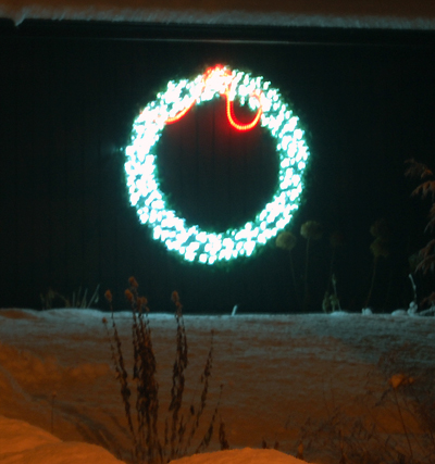 More than a few houses in town sport just one decoration. Sometimes it's simply a string of lights along the gutter or, as in this case, a glowing wreath of lights.  David F. Rooney photo