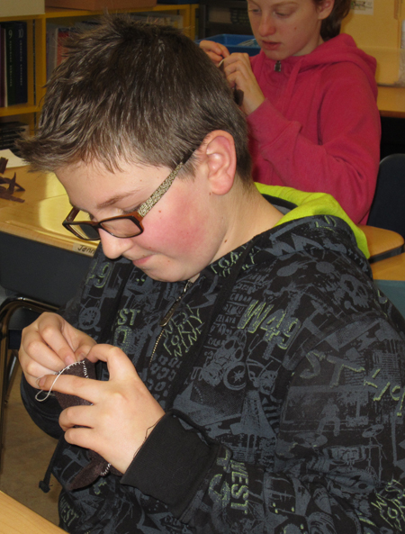 Brogan Copp in Mrs. Gadbois’ grade 5/6 class at AHE on December 14 is working very hard on his Christmas mouse.  The mice are gifts that the students are making for friends and family this Christmas. Photo and caption by Julian Corbett 