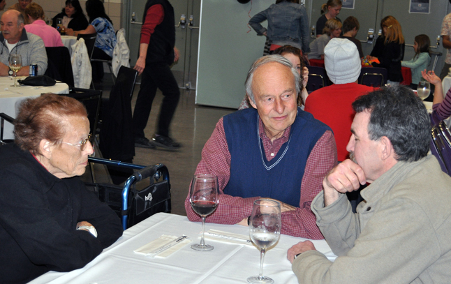 Marlene enjoys a thoughtful conversation with Jeff Nicholson and Jack Heavenor at the United Church's 2009 turkey dinner. Revelstoke Current file photo
