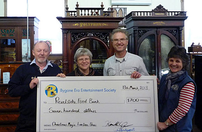 The Bygone Era Entertainment Society presented Patti Larson a cheque for $700 to the Food Bank. The money was raised at the Christmas Magic Lantern Shows held last December. Pictured left to right, Garry Pendergast, Patti Larson, Ken Jones and Pam Doyle. Photo courtesy of Jackie Pendergast