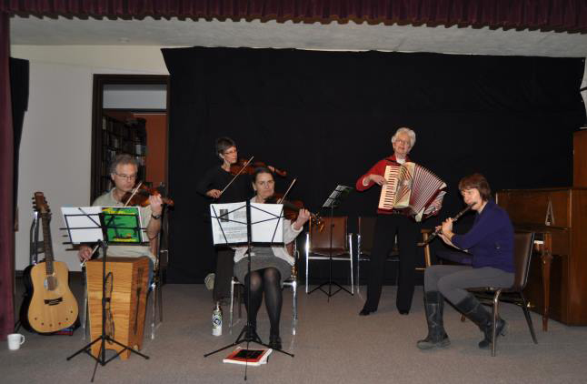 Performers were (left to right) Ken Jones, Laura Stovel and Donna Peterson on fiddle, Judy Vigue on accordion and Judy Peto on flute. John Teed photo